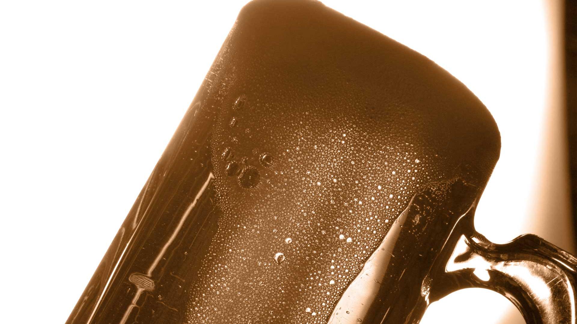 Brewing and Cidery Courses Overflowing glass of beer