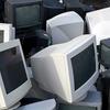 Computer monitors in a waste pile